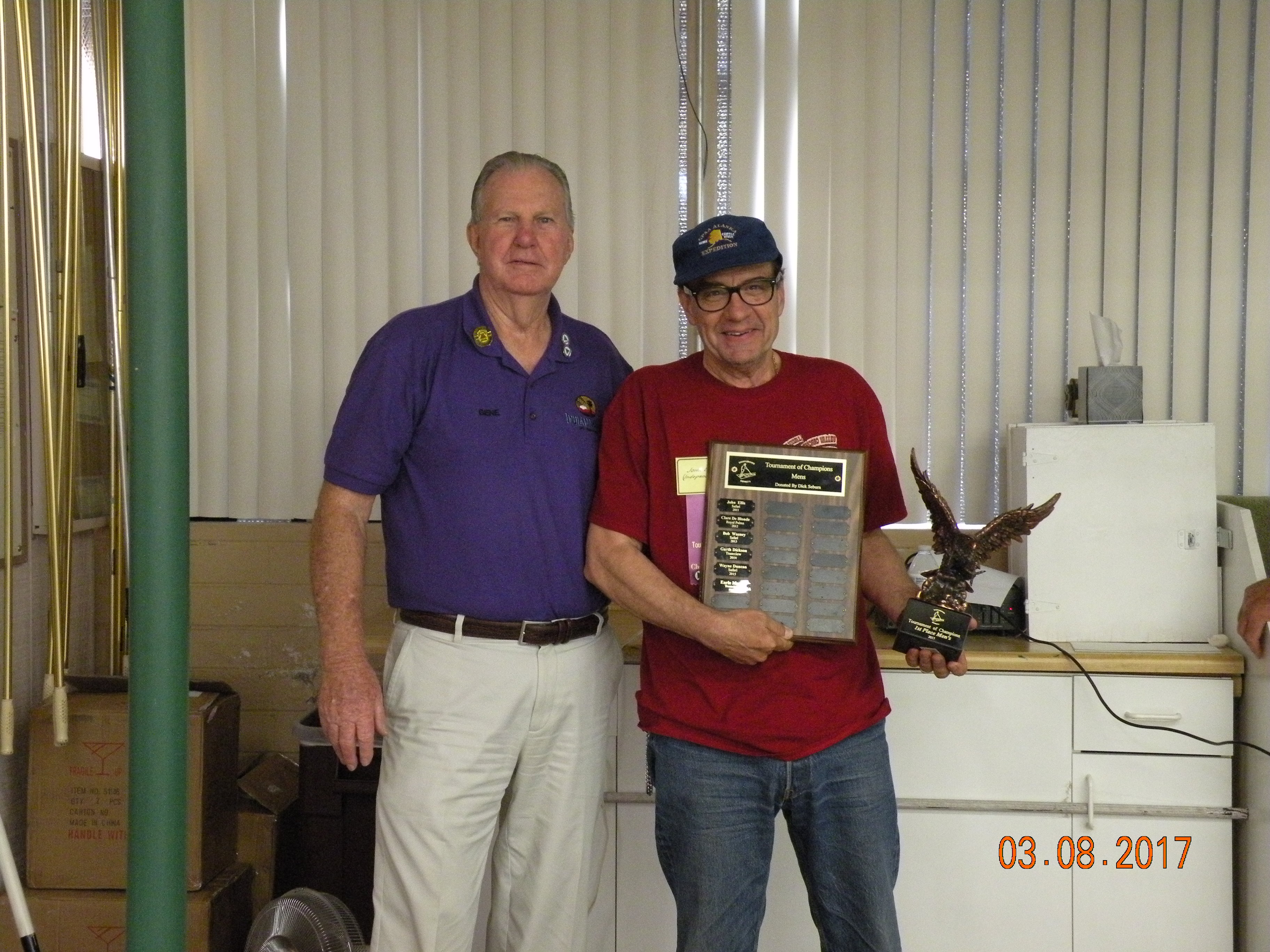 Winner John Ellis displays the   Tournament of Champions Men's Division Travelling Trophy.JPG